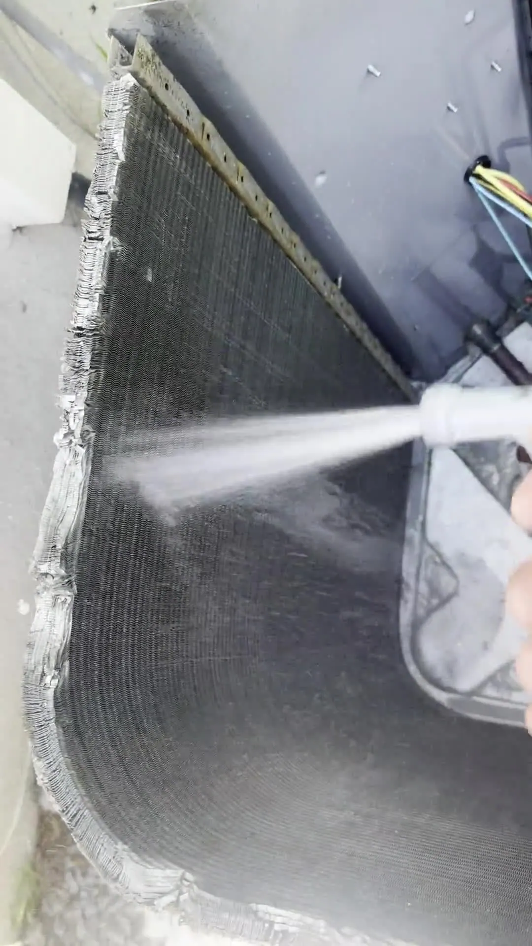 Air conditioning coil being cleaned