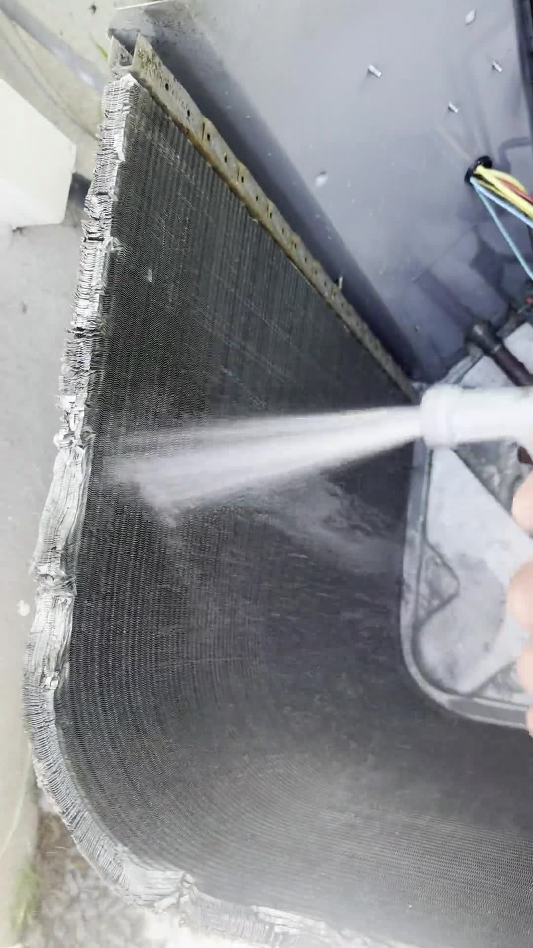 Air conditioning coil being cleaned